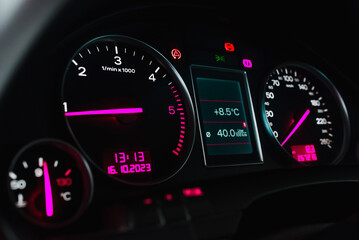 Fototapeta premium Car's dashboard.Modern car dashboard panel at night time.Closeup,selective focus.Toned.