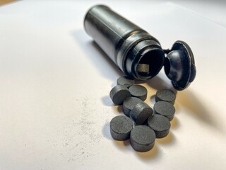 Few activated carbon pills