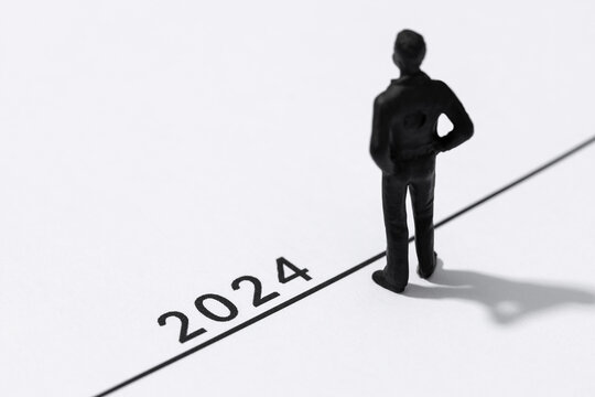 2024 year Business plan concept. Human Figurine on start line looking to the future