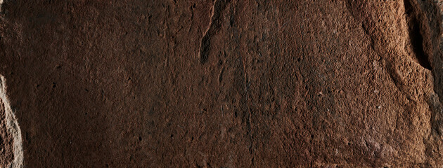 Brown stone texture, dark abstract background. Natural mineral rock close up details, empty backdrop with copy space for design