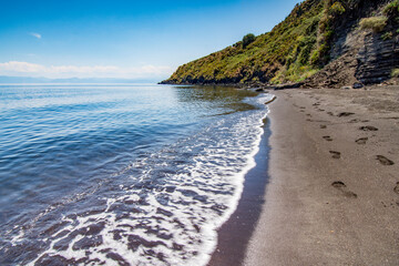 The black volcanic sand beach of Cannitello in Vulcano island, Aeolian islands archipelago IT - 686585548