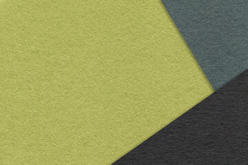 Fototapeta premium Texture of craft green color paper background with olive and black border. Vintage abstract khaki cardboard.