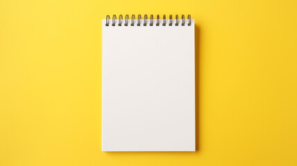A notebooks on yellow background.