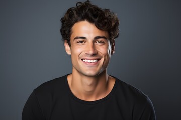 Young man with beautiful smile on grey background