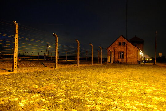 Oświęcim, Poland - November 26, 2023: Some barracks of the Birkenau concentration camp, by night.