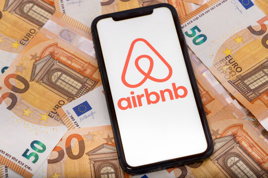 Paris,  France - November 30, 2023 : smartphone with Airbnb application.and euros money Airbnb is an online marketplace and hospitality service, enabling people to lease or rent short-term lodging