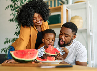 child family kitchen food boy son father mother watermelon fruit slice summer organic meal fun...