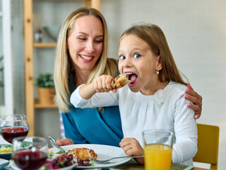 child family lunch food meal eating mother dinner father together happy daughter son boy girl home...