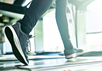 sport treadmill gym running shoe foot leg jogging closeup fitness woman athlete exercising...
