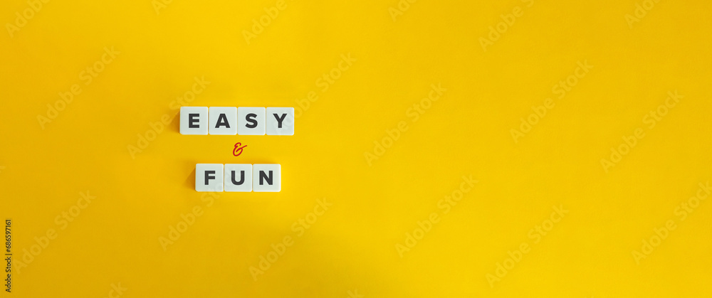 Canvas Prints easy and fun expression on block letter tiles on yellow background. minimalist aesthetics.