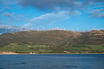 Wind turbines on a mountain by the sea