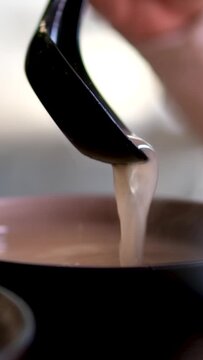  Miso soup is traditional Japanese soup made primarily of miso paste, dashi broth, and additional ingredients such as vegetables, seaweed. and tofu