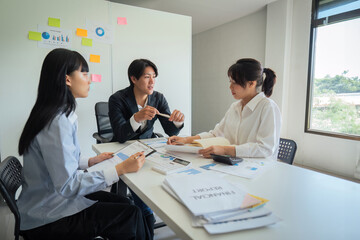 Asian business team meeting to analyze and discuss the situation on the financial report in the meeting room. Investment Consultant, Financial advisor and accounting concept