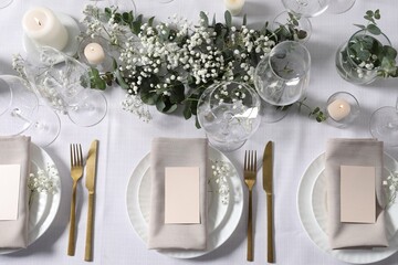 Beautiful table setting with floral decor, flat lay