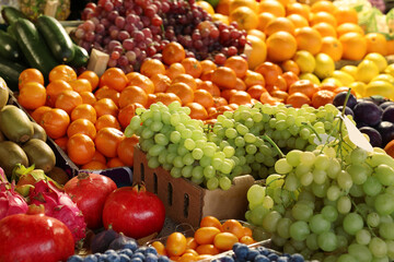 Many different fresh fruits on counter at market