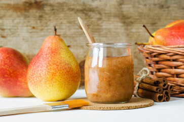 Homemade pear face mask in a glass jar. Natural beauty treatment and spa recipe. Copy space.
