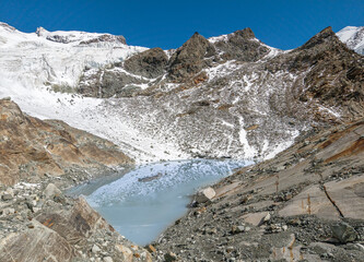 Monte Rosa (Italy) - A mountains view in Val d'Ayas with Monte Rosa mount peak of Alps, alpinistic paths to Rifugio Mezzalama e Guide di Ayas, with Blu lake; Valle d'Aosta region.