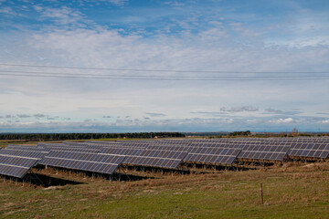 Solar panel farm on a sunny day producing clean electrical energy