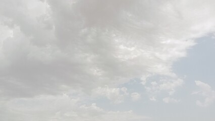 Enchanting Skyline: A Beautiful Vista with Clouds Adorning the Attractive Blue Sky
