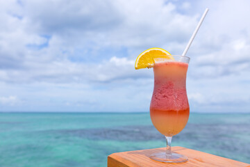 Travel background with drinks Bocal on Caribbean beach.