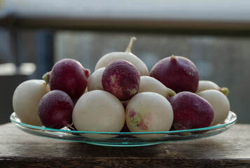 Organically grown fresh White and Purple colorful radishs. A vibrant and peppery radish medley, European radishes (Raphanus sativus), Freshly harvested, Space for text, Selective focus.