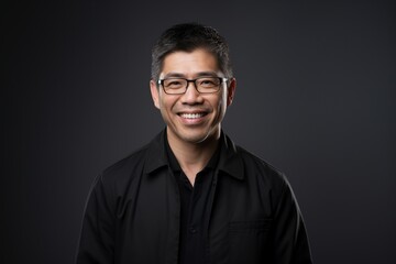 Fototapeta premium Emotional Wellness: Professional therapist showcasing genuine compassion and a comforting smile on a plain background, underlining the vital connection between mental health and effective counseling
