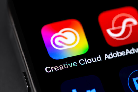 Adobe Creative Cloud mobile icon app on a screen smartphone iPhone closeup. Adobe Creative Cloud - a suite of cross-platform applications from Adobe Systems. Batumi, Georgia - November 5, 2023