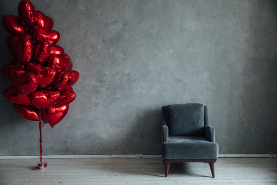red balloons in the shape of a heart chair holiday gifts - Powered by Adobe