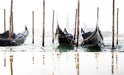 high waves splashing along gondolas in Venice Italy - 686645322
