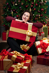 Young happy woman received new year gifts....