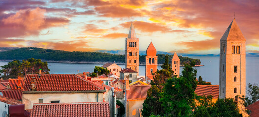 Beautiful Island Rab in Croatia. Townscape panorama over sunset. popular tourist destination. - obrazy, fototapety, plakaty