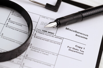 IRS Form 1099-misc Miscellaneous income blank on A4 tablet lies on office table with pen and...