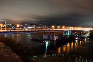 Foto op Plexiglas night city, photo of bridge over river, light of lanterns in the night, road bridge © Aleksey