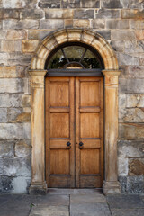 Fototapeta na wymiar Old Georgian stone townhouse door with fanlight window above door