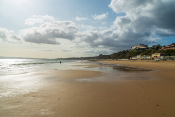 The wet sand on Bournemouth West Beach in front of West Cliff, , Bournemouth, UK