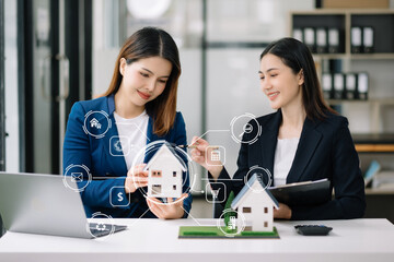 Real estate broker agent presenting and consult to customer to decision making sign insurance form agreement, home model, concerning mortgage loan offer