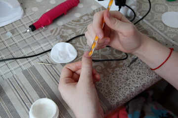 Manicurist makes nails close up