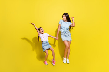 Photo of active positive cheerful kids girls dance on school discotheque occasion isolated over bright color background