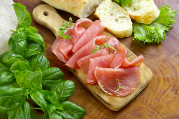 smoked ham of pork on a wooden board
