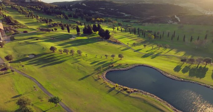 Elevated Greens: A Breathtaking Aerial View of Golf Courses in Mountainous Landscapes. High quality 4k footage