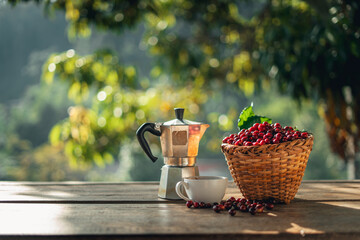 Coffee cherry beans in a basket placed on a wooden table