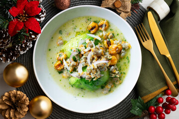 Ceviche with cockles and avocado. Christmas food served on a table decorated with Christmas motifs.