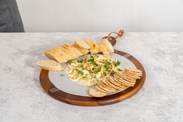 Butter board with vegetables and bread