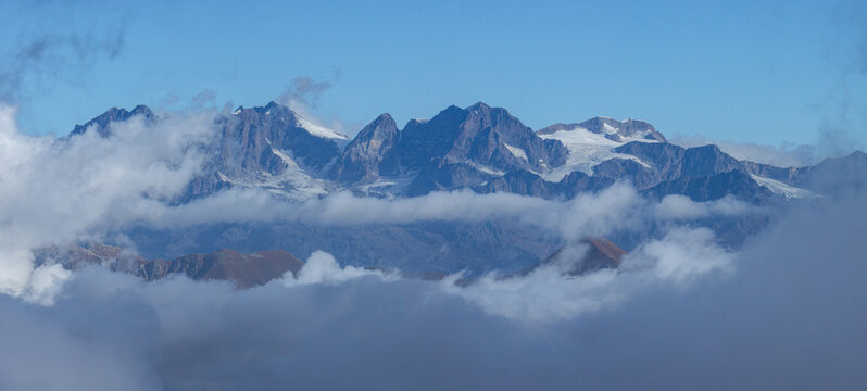 The Valtellina mountains shrouded in fog, taken from Val Madre, a small valley near the town of Colorina, Lombardy, Italy - 15 October 2023.