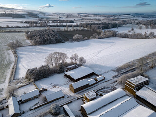 Winter Landscape - Aerial view of a snow covered agricultural landscape in North Yorkshire in the United Kingdom. - obrazy, fototapety, plakaty