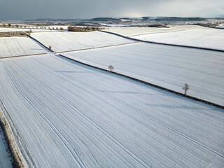 Winter Landscape - Aerial view of a snow covered agricultural landscape in North Yorkshire in the United Kingdom.