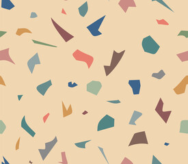 Endless terrazzo pattern of colorful shreds on beige background