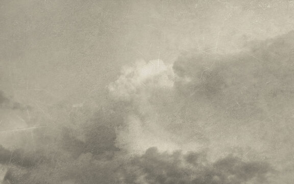 Vintage background with clouds and old paper texture. Handmade textured backdrop. Aged wallpaper for card. Monochrome poster for design interior. Grunge template.