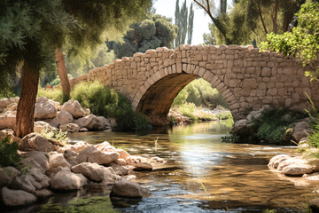 Old stone bridge over a calm river stream in the park