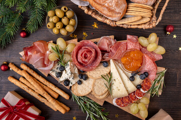 Party charcuterie board italian food antipasti prosciutto ham, salami and cheese appetizers served...